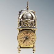 A reproduction brass lantern clock,