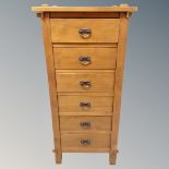 A contemporary hardwood six drawer narrow chest,