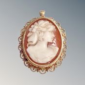 A shell carved cameo brooch mounted in 18ct yellow gold, 7.3g gross.