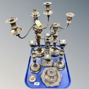 A tray of silver-plated candlesticks and candelabra