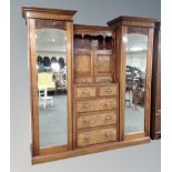 A Victorian walnut compactum sentry door wardrobe with matching mirrored dressing table