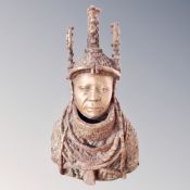 A Benin bronze bust of The Oba of Benin, height 23 cm.