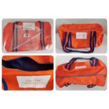 A Calvin Klein Ck One orange Duffle Bag.
