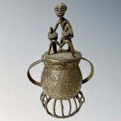 A Benin cast bronze twin handled goblet with native drummer lid, height 18 cm.