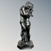 A contemporary resin figure of two lovers, height 37 cm.