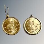Two 1/10 oz Krugerrand coins, each mounted in 9ct gold, gross 7.7g.