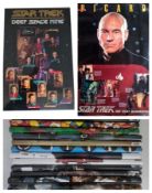 A collection of posters to include Star Trek (Door posters), Rolling Stone, Call of duty.