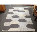 A contemporary wool rug,