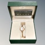 A Gucci lady's wristwatch in retail box with warranty card and booklet