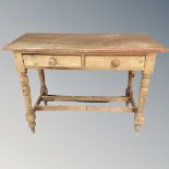 A Victorian pine two drawer side table,