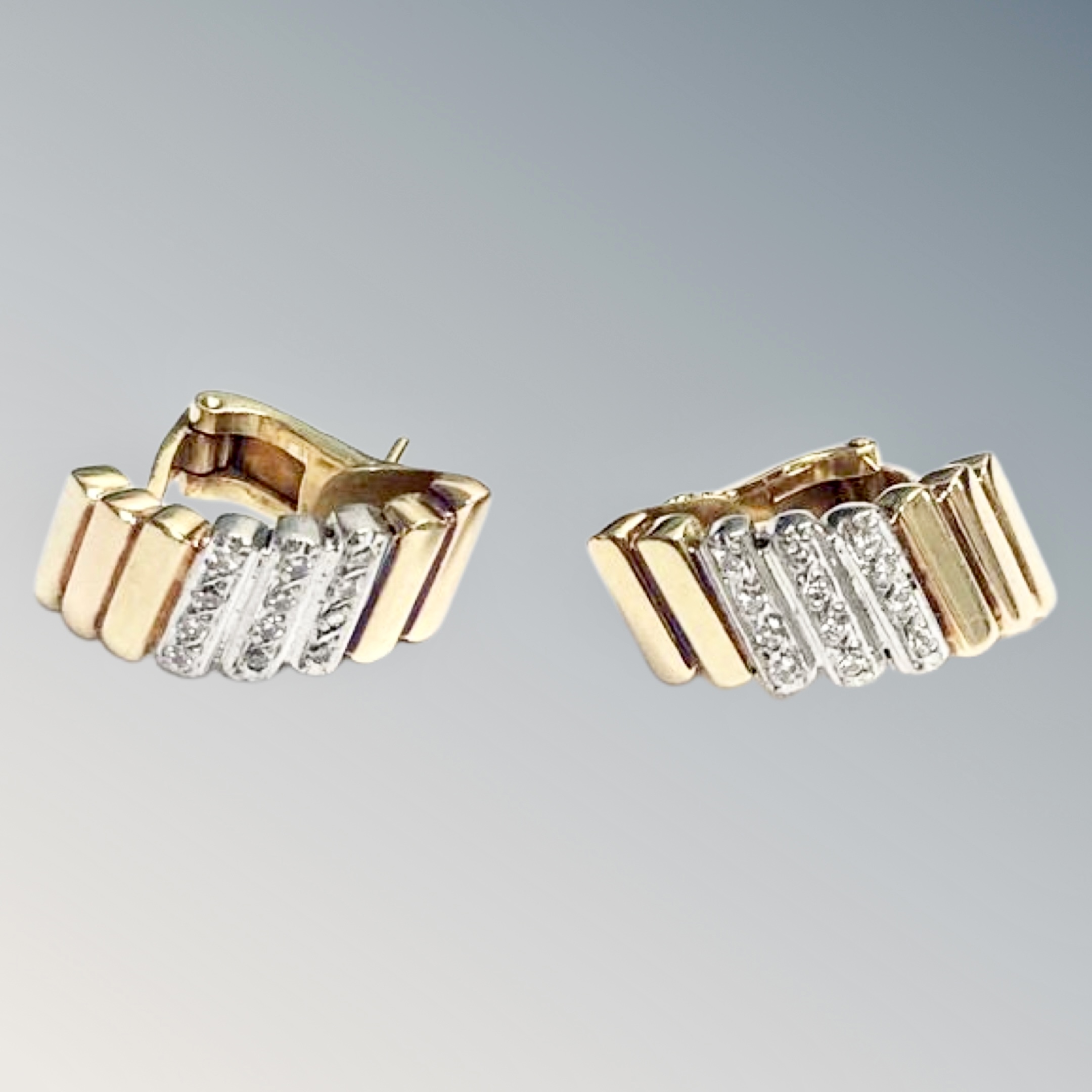 A pair of yellow gold earrings (tested 18ct), set in block bar pattern, set with diamonds, 14.4g.