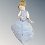 A Lladro figure of a girl in blue dress