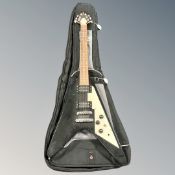 A Challenge 'flying-V' style electric guitar in carry bag.