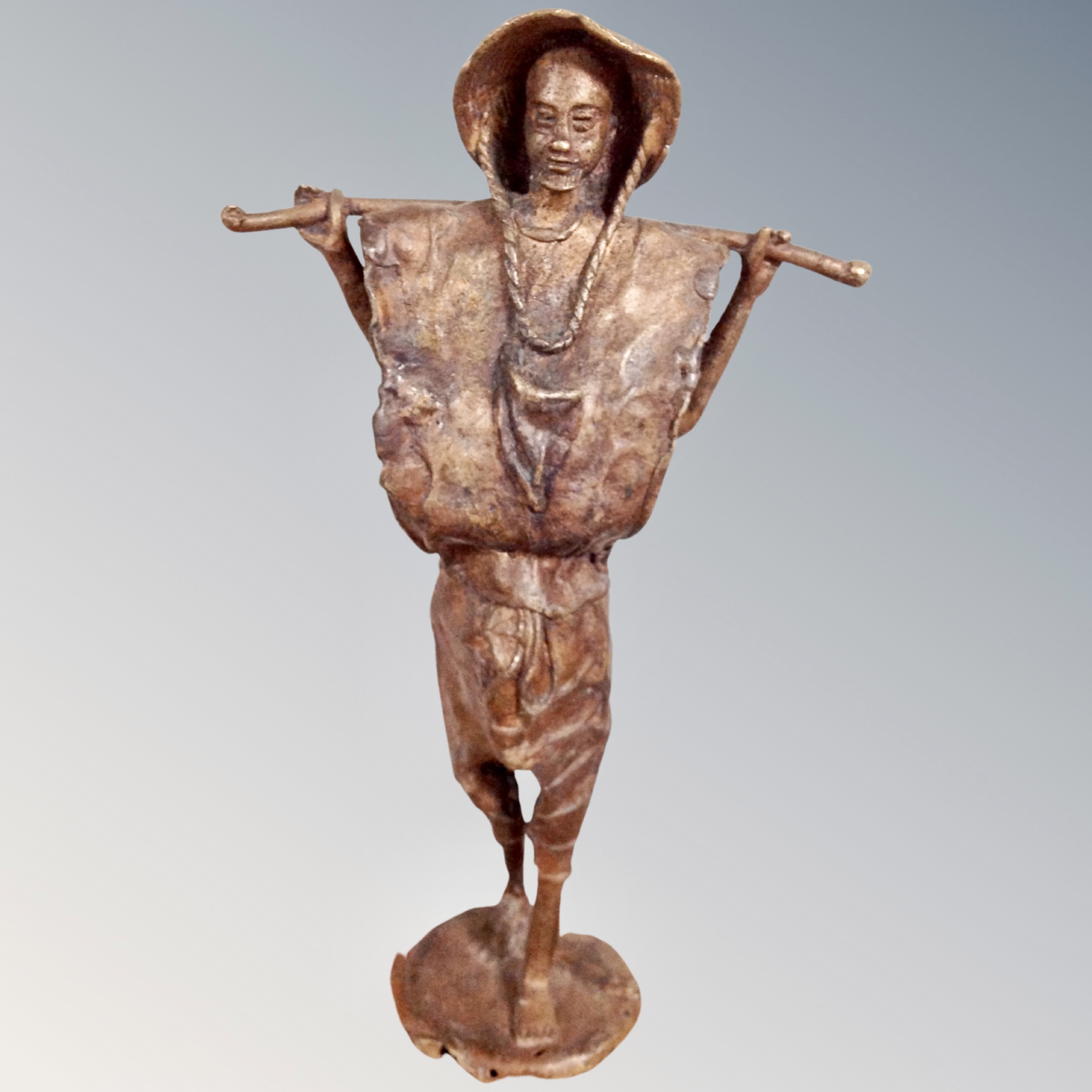 A West African cast bronze figure - Herdsman, height 33 cm.