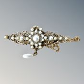 A heavily decorated with pearls, yellow metal antique brooch,9.