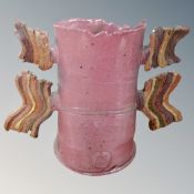 Colin Pearson (1923-2007) A winged stoneware vessel in pink glaze,
