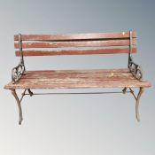 A wooden metal ended garden bench