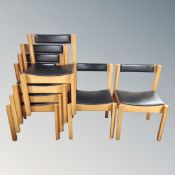A set of six 20th century beech and black vinyl stacking chairs