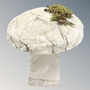 A concrete staddle stone