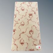 A contrasting pair of Brintons all wool 'Classic Floral' rugs, each 70 cm x 136 cm.