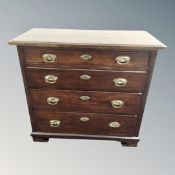 A 19th century stained pine four drawer chest on bracket feet