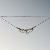 An Art Deco silver and paste necklace.