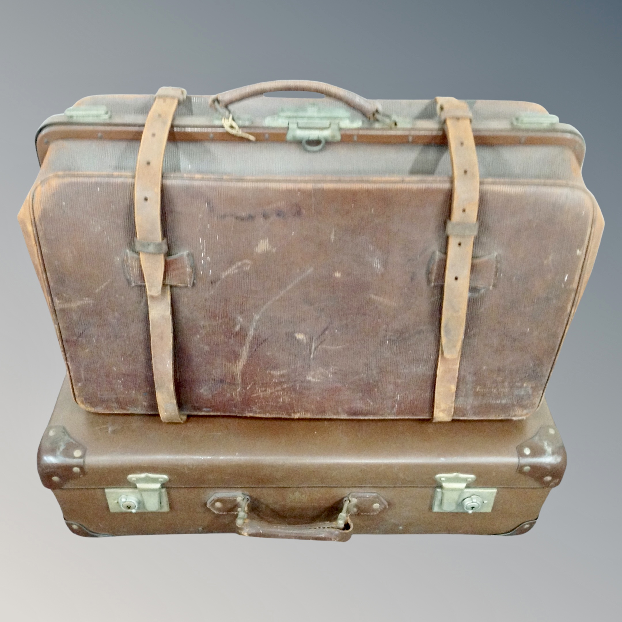 A vintage leather valise together with a vintage luggage case.