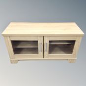 A light oak two drawer entertainment stand