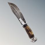 A flat bladed hunting knife