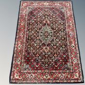 A machined rug of Persian design,