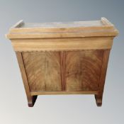 A continental mahogany wall cabinet