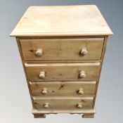 A pine four drawer chest