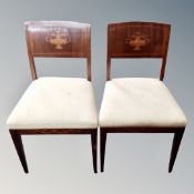 A pair of inlaid mahogany antiques chairs