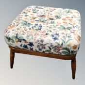 An Ercol footstool with cushion