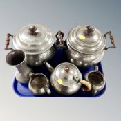 A tray containing a pair of antique pewter twin-handled lidded cooking pots together with a Tudric