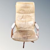 A tab leather 20th century swivel chair