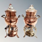 Two vintage copper and brass samovar stands with burners and taps.