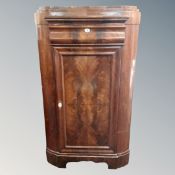 A 19th century mahogany corner cabinet fitted a drawer