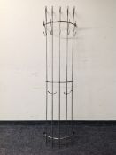 A contemporary metal wall mounted coat rack