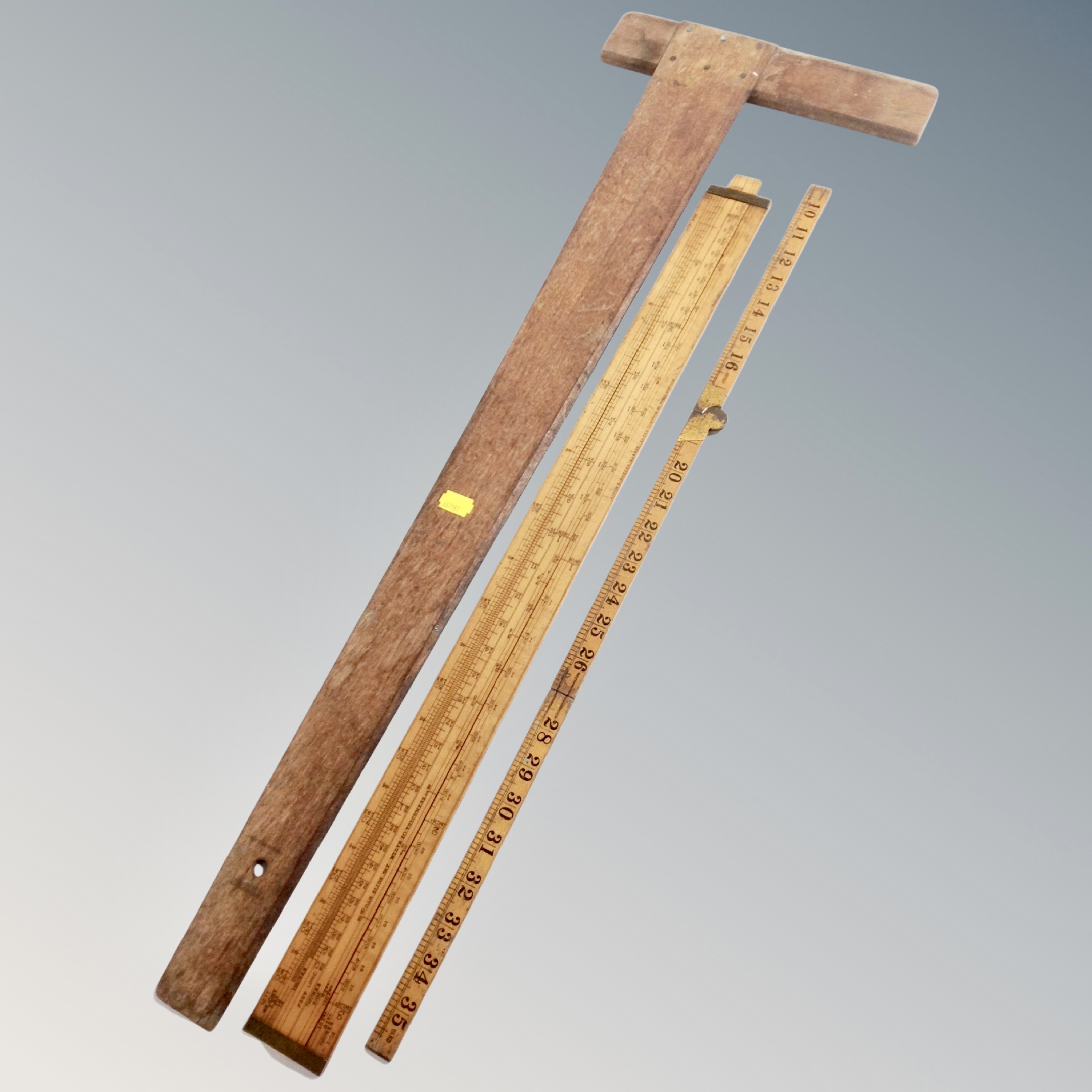 An antique boxwood ruler by Rabone, together with a further boxwood ruler by Asoton and Mander.