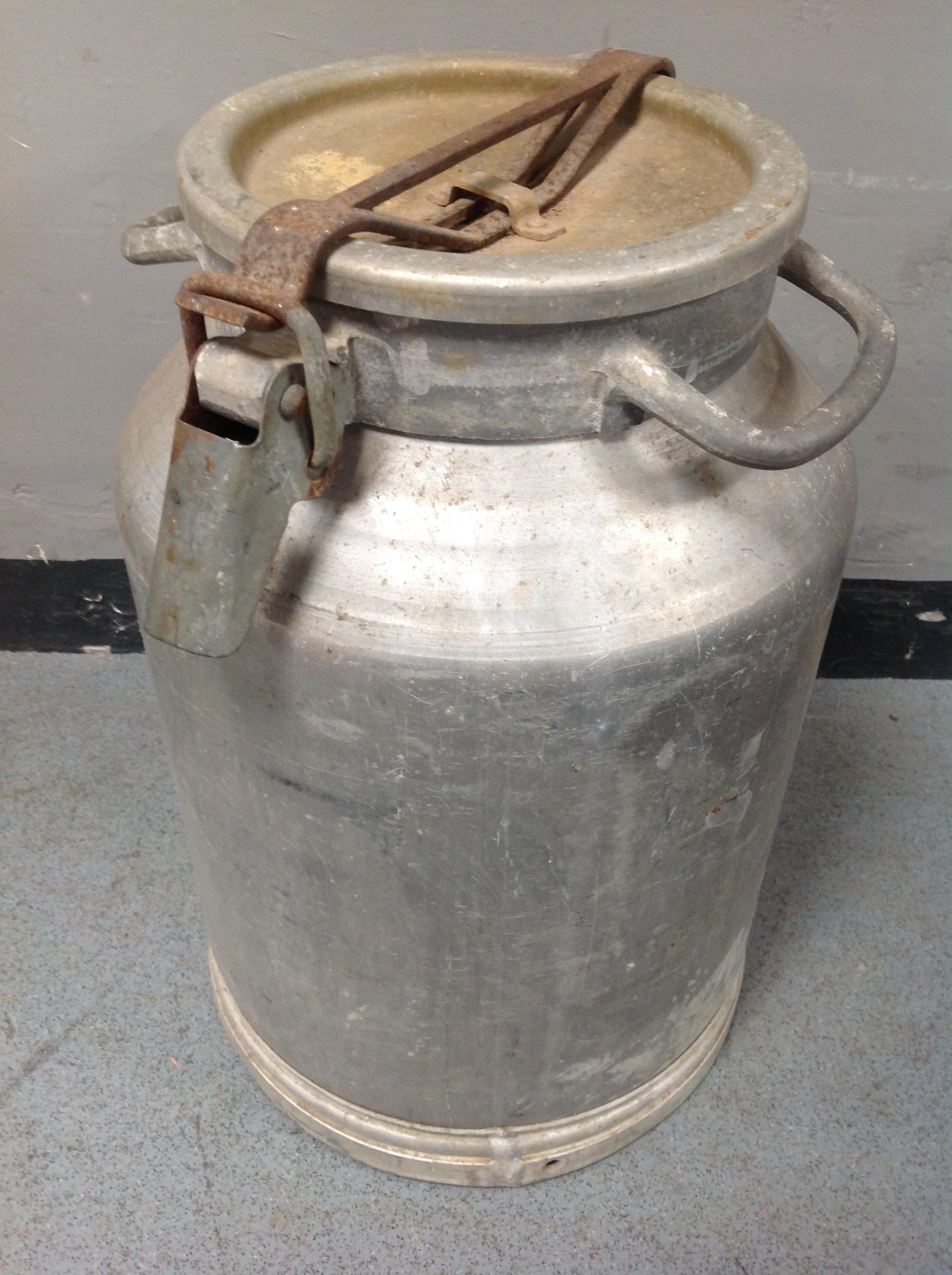 An aluminium milk churn.