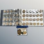 A coin album and box containing pre-decimal coins,