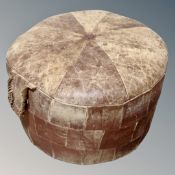 A 20th century Danish circular leather footstool.