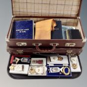 A collection of Masonic memorabilia, two cases, booklets, lodge sash, medals etc.