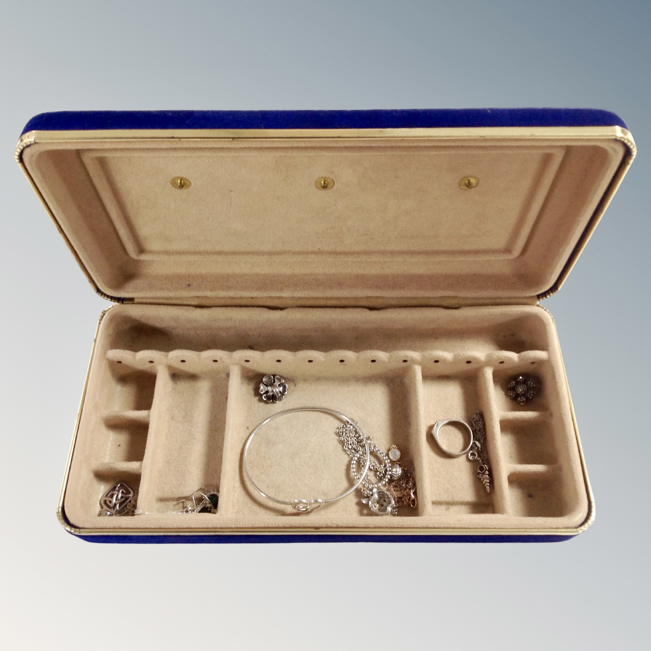 A jewellery box containing silver bangle, dress ring, pendants,