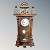 An antique mahogany and beech cased 8 day wall clock.