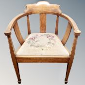 An Edwardian inlaid mahogany occasional chair