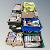 A pallet containing a very large quantity of assorted DVDs and CDs.