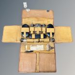 A Mappin & Webb tan leather gent's travel case, containing five silver-mounted bottles, brushes,