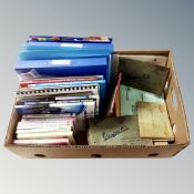 A box containing a quantity of vintage and later Vespa scooter service manuals and books together